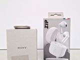 sony earphones in a box next to a box of packaging