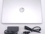 a laptop with a power cord and a charger on it