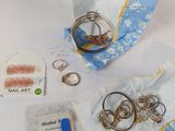 a bag of rings and other jewelry on a table