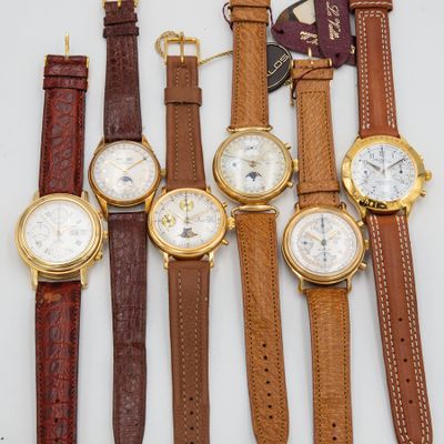 four different types of watches are lined up on a white surface