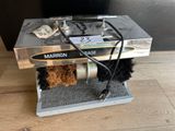 a machine that is sitting on top of a wooden table