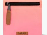 a pink purse with a zipper and a brown tag on it