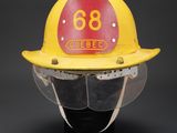 a close up of a fireman ' s helmet on a mannequin head