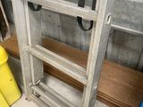 a ladder that is leaning against a wall in a room
