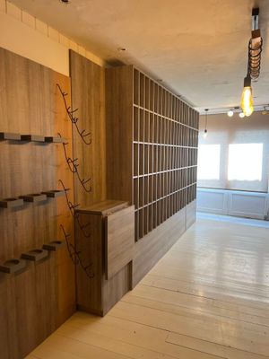 a room with a lot of bookshelves and shelves in it