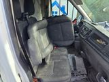 a white van with a black seat in the back of it