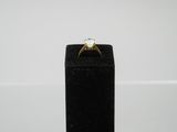 a close up of a ring with a diamond on top of it