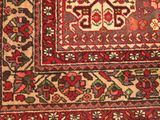 an image of a rug with a red and green design