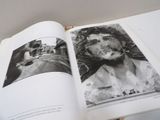 an open book with a picture of a man smoking a cigarette