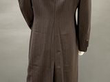 the back view of a mannequin wearing a suit and tie