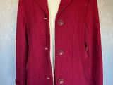 a close up of a red coat on a mannequin mannequin mannequin mannequin mannequin mannequin mannequin manne