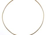 an image of a gold necklace with black stones on a white background