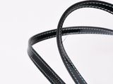 a black strap with blue stitching on it on a white surface