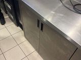 a stainless steel counter top in a commercial kitchen