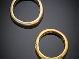 a pair of gold - plated and diamond - set rings