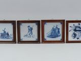 five framed pictures of people on a wall