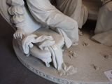 a statue of a man and a woman sitting on a chair