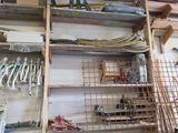 a room with a bunch of tools on the shelves