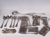 a lot of silver spoons and forks on the table
