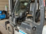 a forklift truck that is parked in a garage