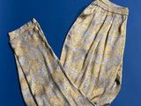 a pair of yellow and blue patterned pants on a blue background