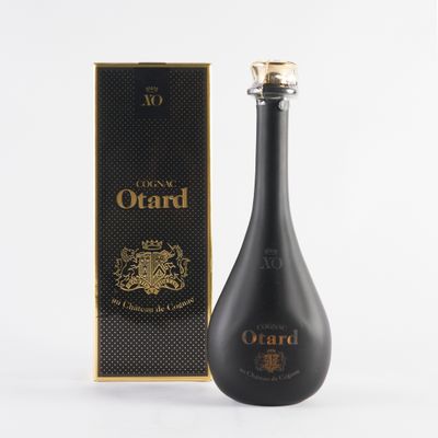 a bottle of ouard with a box on a white background