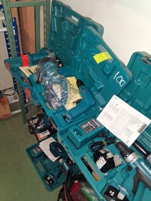 a blue tool box with tools in it on the floor
