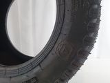 tire tread of a truck on a white surface with a white background