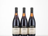 three bottles of wine sitting on top of a table