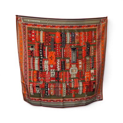 an orange and black rug with a pattern on it