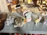 a table with a bunch of small figurines sitting on top of it