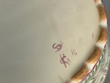 a close up of a vase with a decorative decoration on it