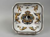 a plate with a picture of a man and a woman on it