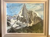 a painting of a mountain in a frame on the wall