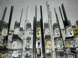 a lot of cell phones that are on a rack