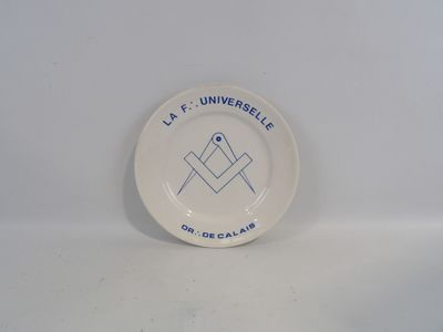 a white plate with a blue and white design on it