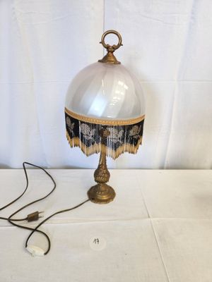 an image of a table lamp with a glass shade on it