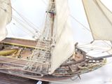 a model of a sailing ship on display on a table