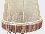 a lamp that is sitting on a table next to a lamp