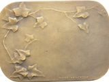 a picture of a metal plaque with flowers on it