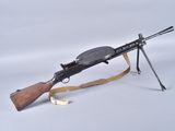 an old machine gun on a white background with a wooden handle