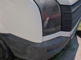 a white van that is parked on the side of the road