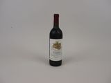 a bottle of wine that is sitting on a table