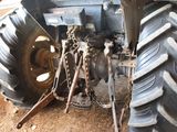 a tractor that is parked in the dirt