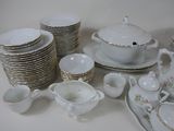 a lot of dishes and cups and saucers on the table