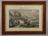 a framed picture of a battle scene with a man on horseback