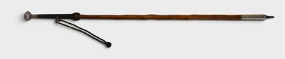 an image of a wooden stick with a black handle