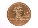 a coin with a picture of a ship on it
