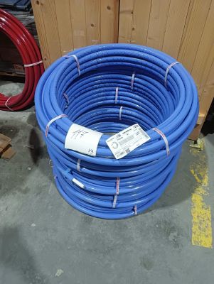 a large blue hose sitting on the floor next to other hoses