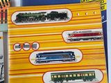 a lot of toy trains on display on a table